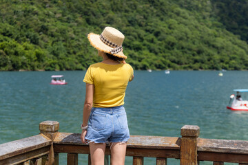 Wall Mural - Travel woman enjoy the lake view