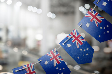 A garland of Australia national flags on an abstract blurred background