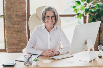 Sticker - Photo of happy pretty lady leader wear spectacles white shirt smiling working modern gadget indoors workplace workshop