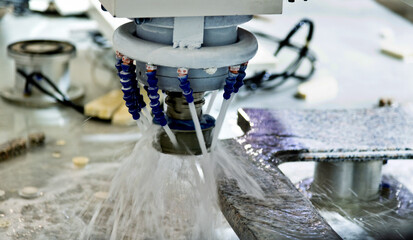 Close up of CNC machine working on the rock