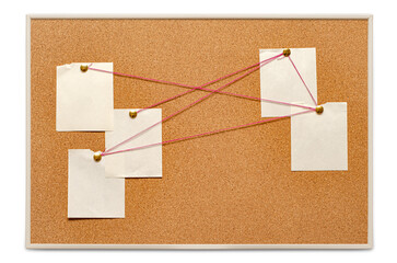 Blank paper notes are pinned to a cork board. The concept of detective investigation. Copy space.