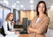© BillionPhotos.com - Modern young Business woman posing in office.