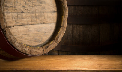 Wall Mural - Excellent red wine bottles, wineglass, barrel and corkscrew on a rustic wooden table: traditional winemaking and wine tasting concept. High quality photo