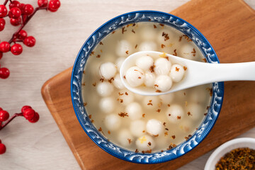 Little white tangyuan with sweet osmanthus honey and syrup soup.