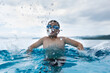 © xy - Boy swimming and spitting water from mouth