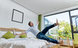 © xy - Excited man jumping to the bed