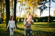 © andriyyavor - Family in green nature together
