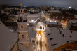Aerial winter snowy night view of Gates of Dawn (Ausros Vartai) Vilnius old town, Lithuania