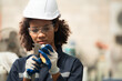 © Wosunan - A young female engineer inspects and repairs parts of a robotic welding machine