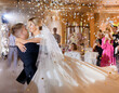 Bride Couple Waving While Dacning With Confetti