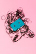 © ADDICTIVE STOCK - Retro cassette with tangled tape on pink surface