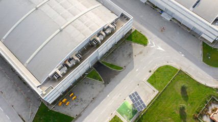 Wall Mural - Aerial view on the entrance of an industrial container. The shed is white and gray and used as a warehouse.