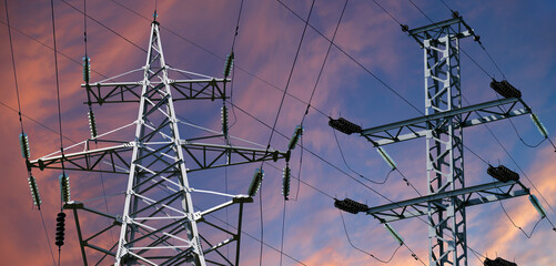 Wall Mural - Electricity pylon (high voltage power line) against the background of a romantic evening sky