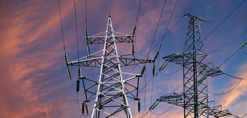 Wall Mural - Electricity pylon (high voltage power line) against the background of a romantic evening sky