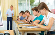 © JackF - Portrait of teen pupils using mobile phones during lesson