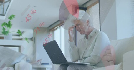 Poster - Animation of financial data processing over senior caucasian woman using laptop