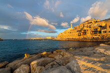 A Rainbow Appears Above The Skyline Of Tel Aviv, Seen From The Old Town Harbor Of The Historic Ancient City Of Jaffa, Israel At Sunset.