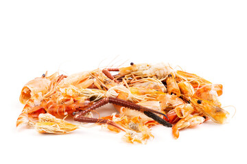 Wall Mural - Shrimp heads and shrimp shells, food waste, leftovers, waste. Natural seafood. Lunch. Dinner isolated on white background.