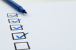 © xy - Blue pen marking on checklist sheet