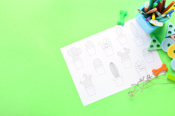 Wall Mural - Coloring page, felt-tip pens, pencils, toys and flower on green background