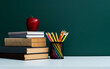 © xy - School supplies in front of the blackboard