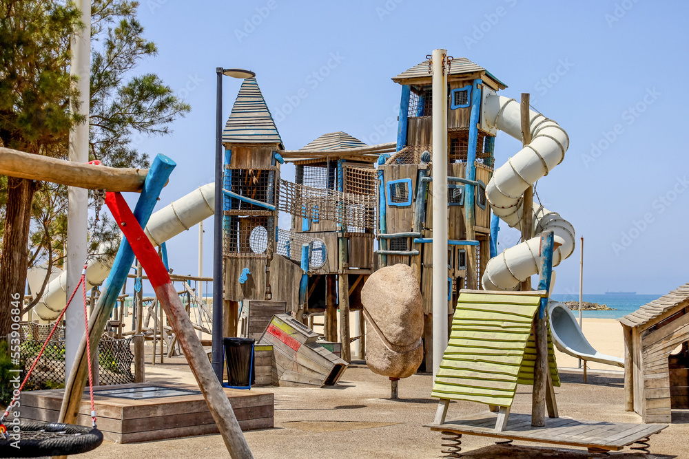 View of children's complex on playground near sea
