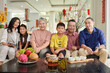 © DragonImages - Three generation of big family celebrating Chinese New Year at home