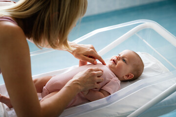 Wall Mural - Portrait of a mother with her newborn baby