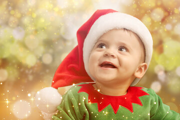 Poster - Cute baby in Christmas costume against blurred lights. Magical festive atmosphere