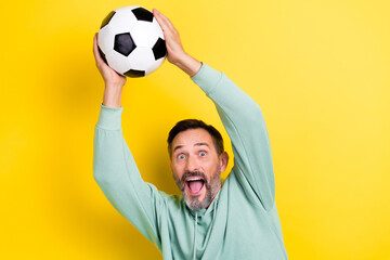 Sticker - Portrait of funky crazy man have free time hobby entertainment catch ball intense football game isolated on yellow color background