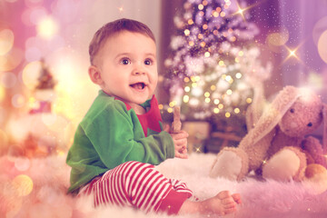 Sticker - Baby wearing cute elf costume on floor in room decorated for Christmas. Magical festive atmosphere