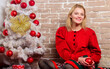 © be free - Girl in dress decorate christmas tree with ornaments. Woman cheerful relaxing near christmas tree. Things you must do before holiday celebration start. Christmas eve concept. Waiting for christmas