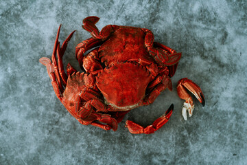 Wall Mural - cooked velvet crabs on a gray stone surface