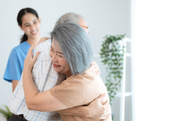 Wall Mural - Portrait of happy senior couple with wife embracing husband, nurse doctor senior care caregiver help assistance retirement at home nursing, or hugging after sick in hospital