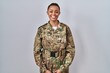 © Krakenimages.com - Beautiful african american woman wearing camouflage army uniform with a happy and cool smile on face. lucky person.