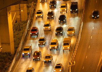 Poster - Crowd of busy cars with heavy traffic jam in rush hour on highway road street on bridge in Bangkok Downtown,urban city in Asia, Thailand. Intersection. Toll gate in Sathorn.Driving congestion at night