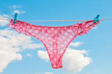 pink female underwear on a clothesline