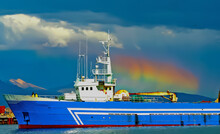 Cargo Ship In Harbor Of Iceland, Spectacular Circumhorizontal Arc Optical Halo Phenomenon "fire Rainbow", Storm Clouds Over Mountains - Reykjavik