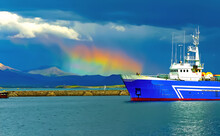 Cargo Ship In Harbor Of Iceland, Spectacular Circumhorizontal Arc Optical Halo Phenomenon "fire Rainbow", Storm Clouds Over Mountains - Reykjavik