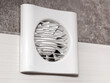 The fan is built into the wall in the bathroom, toilet or kitchen