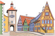 Old medieval street with colorful houses and clock tower in Rothenburg ob der Tauber.