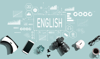 Learning English concept with electronic gadgets and office supplies - flat lay