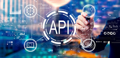 API - application programming interface concept with businessman on night city background