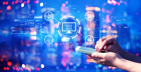 Wall Mural - fintech theme with person using a smartphone in a city at night