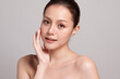 © kitthanes  - Beautiful young asian woman with clean fresh skin on grey background, Face care, Facial treatment, Cosmetology, beauty and spa, Asian women portrait.