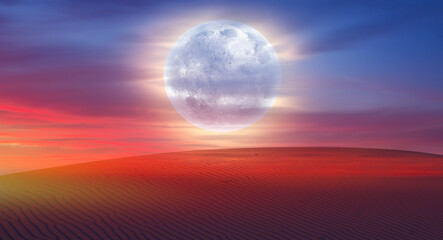 beautiful sand dunes in the sahara desert at sunrise with super full moon - sahara, morocco 