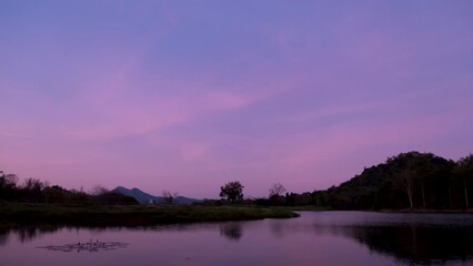 Wall Mural - Timelapse, Lake view during dusk to night time. Stary night, purple sky.