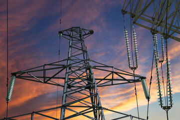 Electricity pylon (high voltage power line) against the background of a romantic evening sky