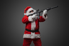 Studio Shot Of Santa Claus Shooter With Long Beard Aiming Rifle.