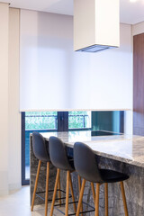 Poster - Roller blind large size on the window in the interior. Motorized roller shade white color in the kitchen. Bar counter with built-in hob and hood above it are near the window. Smart home concept. 